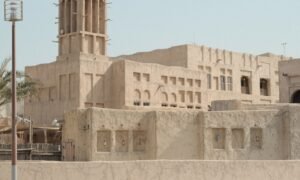 A traditional building with a wind tower, an example of heritage Arabian architecture