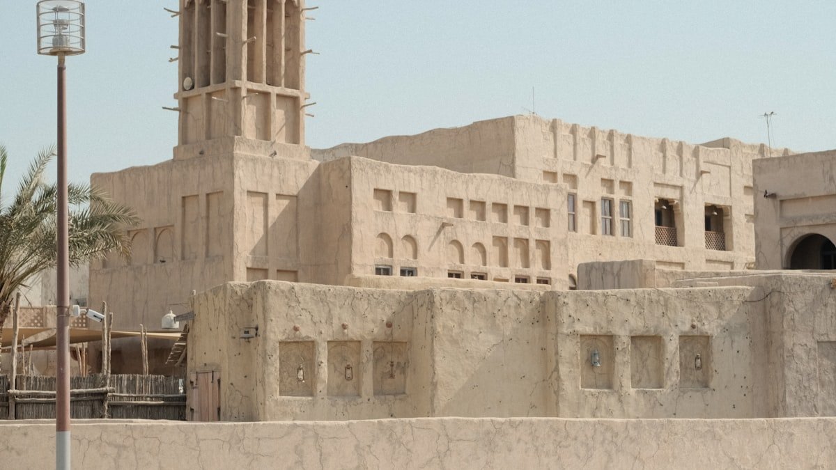 A traditional building with a wind tower, an example of heritage Arabian architecture
