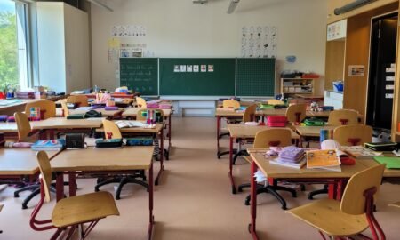 Bright classroom with rows of desks and chairs