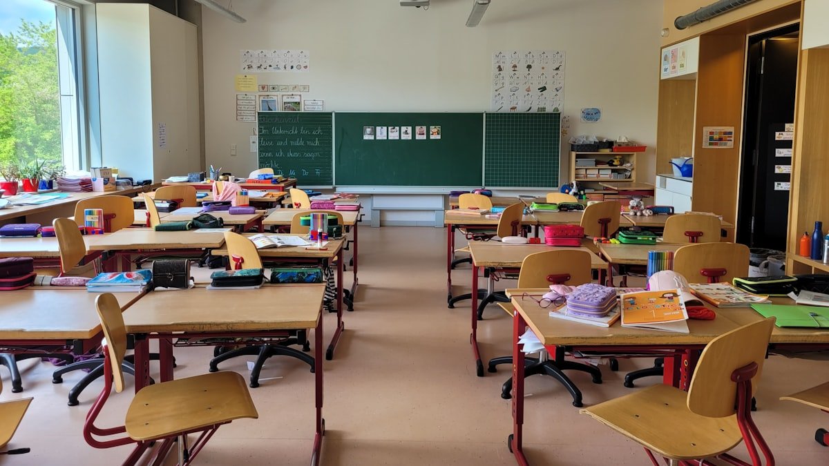 Bright classroom with rows of desks and chairs