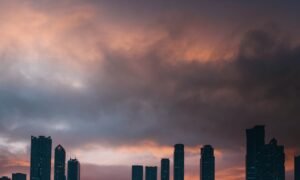 Sharjah skyline at sunset, the neighbouring emirate Ajman residents commonly compare against