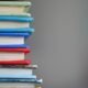 Books on a school library shelf, representing a British curriculum classroom in Ajman
